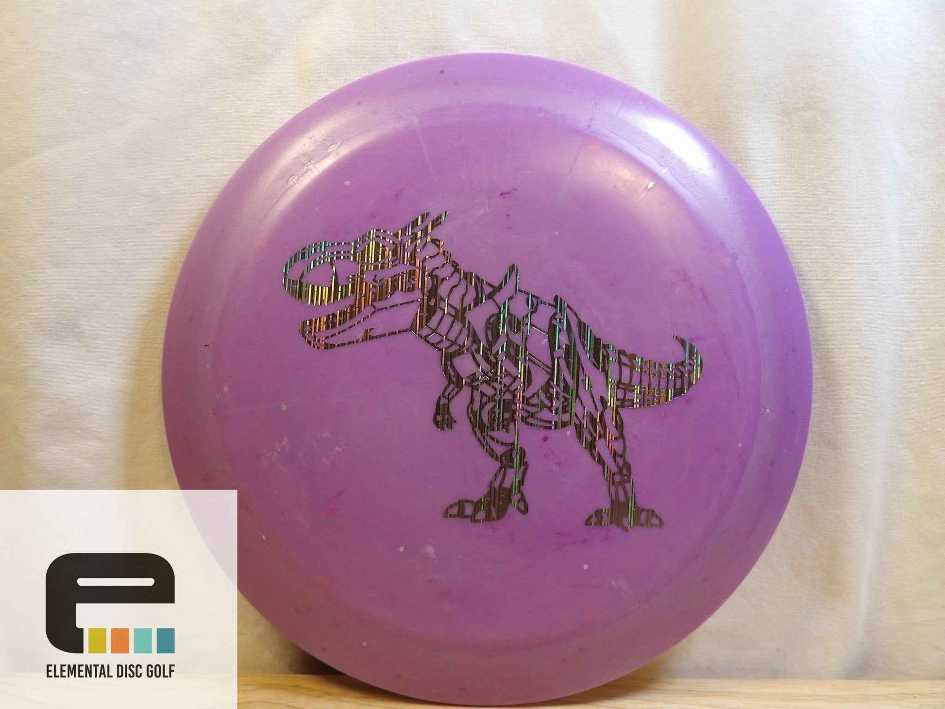Dino Discs Egg Shell Tyrannosaurus Rex (14/5/-3/2) - Elemental Disc Golf