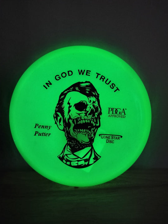 Lone Star Discs "Zombie Abe" Glow Penny - Elemental Disc Golf
