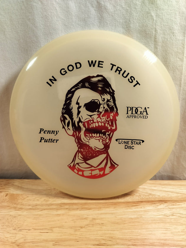 Lone Star Discs "Zombie Abe" Glow Penny - Elemental Disc Golf